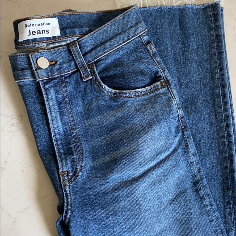 Reformation high waisted jeans with slit hem